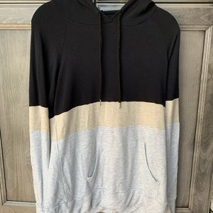 Soft multicolored sweatshirt also has pockets